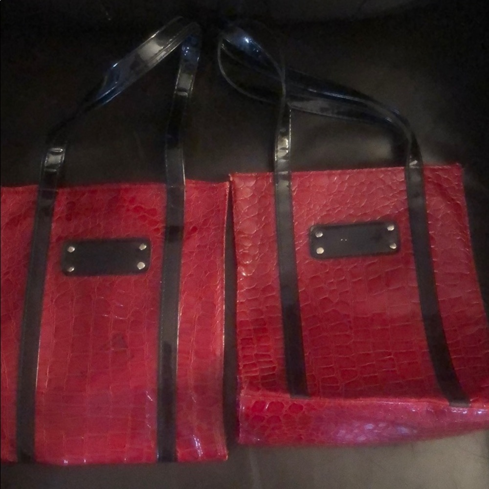 Two pristine Evelin Charles red and black purses